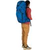 Osprey Exos 58 in Blue Ribbon on model back right