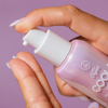 COOLA Dew Good Illuminating Serum Sunscreen SPF 30 in hand