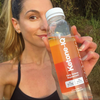 HVMN Ketone IQ 12oz Bottle in hand