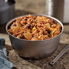 Mountain House Cheesy Beef Enchilada Bowl in bowl at camp