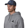 Patagonia P-6 Logo LoPro Trucker Hat in New Navy on model front left