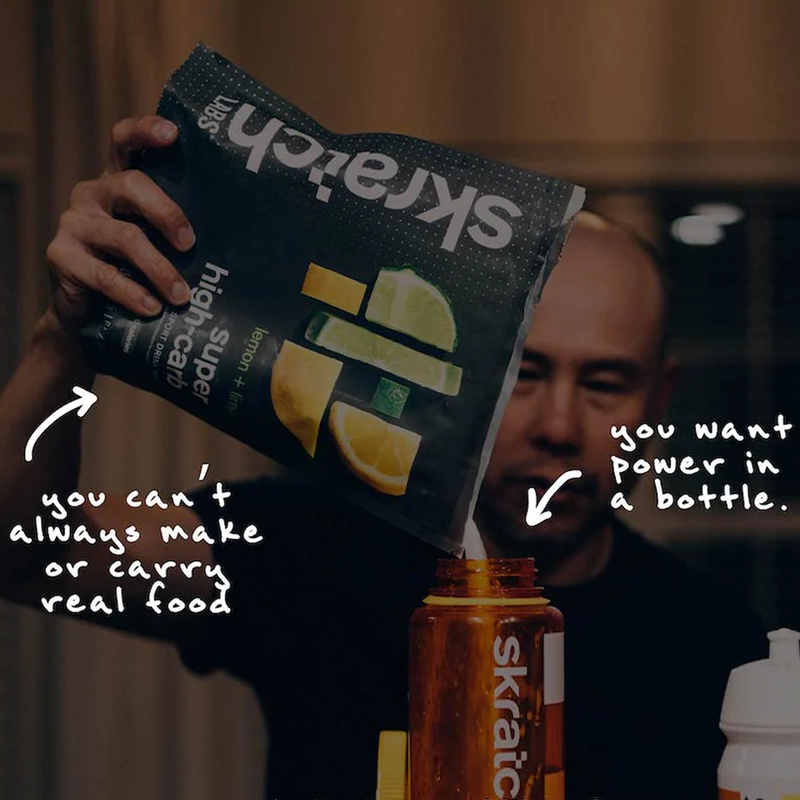 Super High-Carb Drink Mix (8 Servings), Skratch Labs Super High-Carb Drink Mix (8 Servings) being poured in water bottle