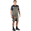 Zoic Men's Ether Camo Short 9 in Green Camo/Black Zip on model front