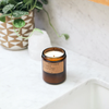 P.F. Candle Co. Amber & Moss - 7.2oz on counter