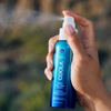 COOLA Classic Face Organic Sunscreen Mist SPF 50 spraying
