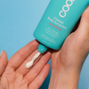 COOLA Classic Body Organic Sunscreen Lotion SPF 50 in hand