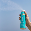 COOLA Classic Body Organic Sunscreen Spray SPF 30 spraying