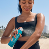 COOLA Classic Body Organic Sunscreen Spray SPF 70 in hand