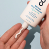COOLA Mineral Body Organic Sunscreen Lotion SPF 50 in hand