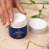 COOLA Refreshing Water Cream Organic Face Sunscreen SPF 50 in hand