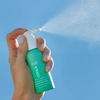 COOLA Scalp & Hair Mist Organic Sunscreen SPF 30 spraying 