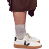 Veja Women's Urca in White Black Natural on model right profile