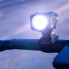 NiteRider Aero Handlebar Mount Lumina/Mako series on handlebar with light on night