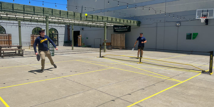 COME PLAY PICKLEBALL AT THE BASEMENT!