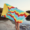 Slowtide Beach Towel at beach with model