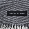 Sackcloth and ashes Essential Blanket Herringbone Ashes logo